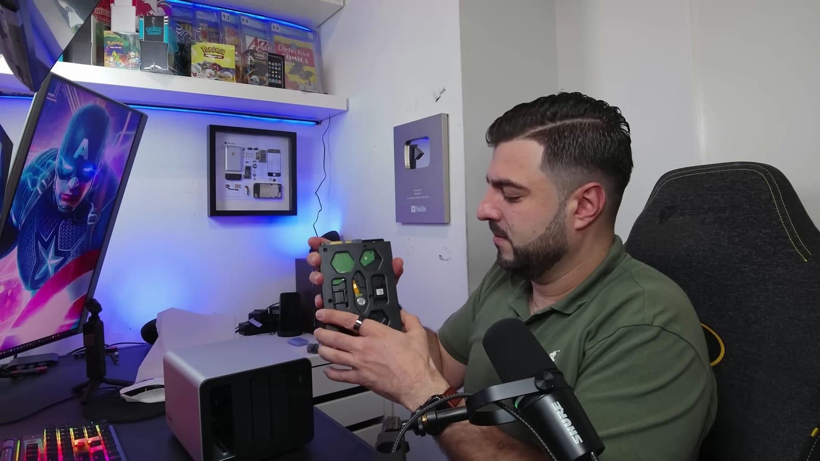 Zino holding a hard drive inside the tool-free drive tray