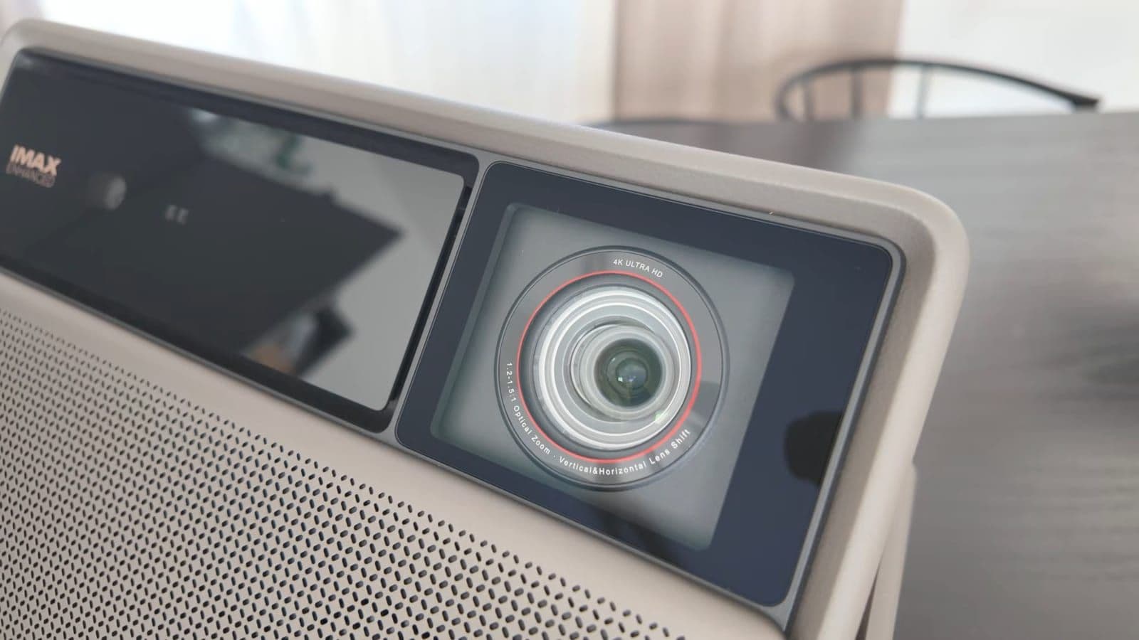Close-up view of XGIMI Horizon 20 Max front panel, Harman Kardon branding, and optical lens